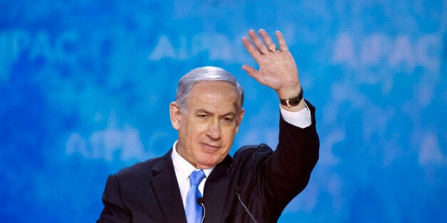 Israeli Prime Minister Benjamin Netanyahu waves at the conclusion of his address to the 2015 American Israel Public Affairs Committee (AIPAC) Policy Conference in Washington, Monday, March 2, 2015. (AP Photo/Cliff Owen)