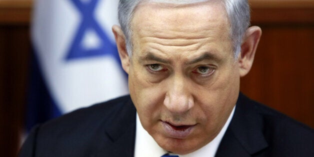 Israeli Prime Minister Benjamin Netanyahu chairs the weekly cabinet meeting at his Jerusalem office, Sunday, March 8, 2015. Tens of thousands of Israelis gathered Saturday night at a Tel Aviv square under the banner "Israel wants change" and called for Netanyahu to be replaced in March 17 national elections. (AP Photo/Gali Tibbon, Pool)