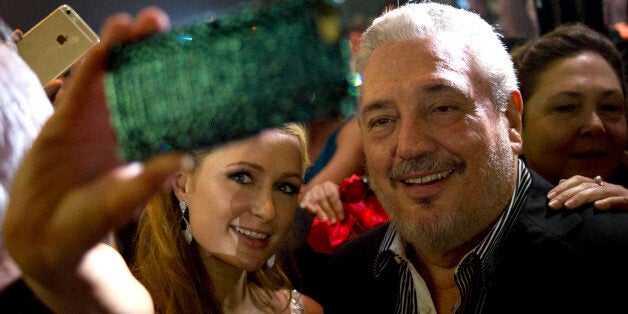 Celebrity Paris Hilton, left, takes a selfie with Fidel Castro Diaz-Balart, son of Cuba's leader Fidel Castro during the gala