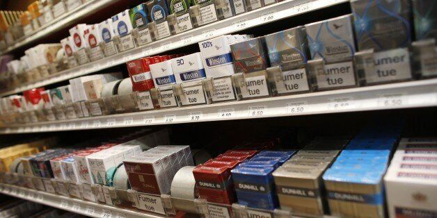 Packs of cigarettes are seen at a tobacconist on March 4, 2015 in Paris. French tobacconists are launching a campaign against the neutral cigarette pack, which Health Minister Marisol Touraine wants to market by 2016. AFP PHOTO / THOMAS SAMSON (Photo credit should read THOMAS SAMSON/AFP/Getty Images)
