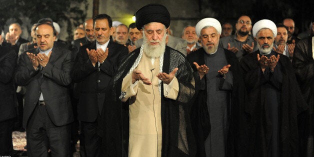 TEHRAN, IRAN - JULY 14: Supreme Leader of Iran Ali Khamenei (C) meets with president of Iran Hassan Rouhani (2th R) and cabinet ministeriel about the ongoing Israeli military airstrikes on Gaza in Tahran, Iran on July 14, 2014. (Photo by leader.ir/Anadolu Agency/Getty Images)