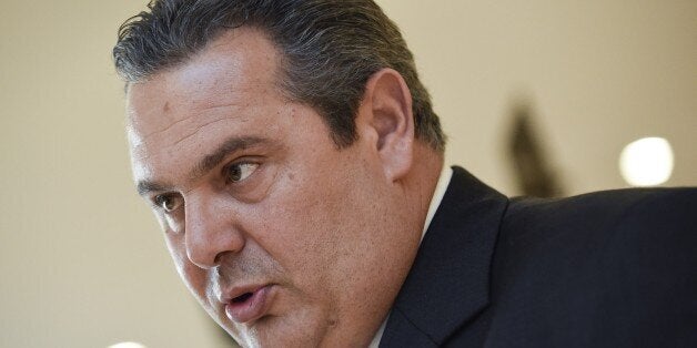 Greek Defense Minister Panos Kammenos talks to an AFP journalist at the European Union Headquarters in Brussels on February 4, 2015. Greek new Prime Minister Alexis Tsipras made Panos Kammenos defence minister in return for leading his nationalist Independent Greeks (ANEL) party into a coalition government with Syriza. AFP PHOTO / JOHN THYS (Photo credit should read JOHN THYS/AFP/Getty Images)