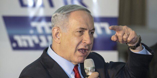 Israeli Prime Minister and Likud party's candidate running for general elections, Benjamin Netanyahu, delivers a speech to his supporters during an election campaign meeting in the Israeli Mediterranean coastal city of Netanya on March 11, 2015. Polls show the centre-left Zionist Union slightly ahead of Likud but analysts say Netanyahu, 65, is best placed to form a parliamentary majority with support from ultra-nationalist and ultra-Orthodox parties. AFP PHOTO / JACK GUEZ (Photo credit should read JACK GUEZ/AFP/Getty Images)