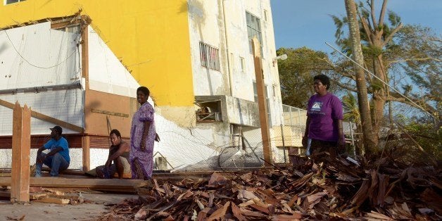 ALTERNATIVE CROP
This photo taken on March 16, 2015 shows residents assessing the damages in devastated Port-Vila, in cyclon
