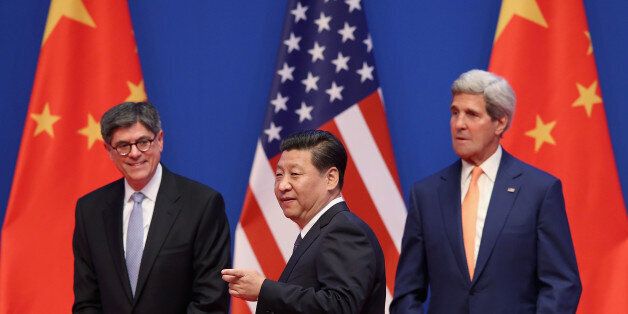 BEIJING, CHINA - JULY 09: Chinese President Xi Jinping (C), U.S. Secretary of State John Kerry (R) and U.S. Treasury Secretary Jack Lew (L) attend the opening ceremony of the 6th China-U.S. Security and Economic Dialogue and 5th round of China-U.S. High Level Consultation on People-to-People Exchange at Diaoyutai State Guest House on July 9, 2014 in Beijing, China. (Photo by Feng Li/Getty Images)