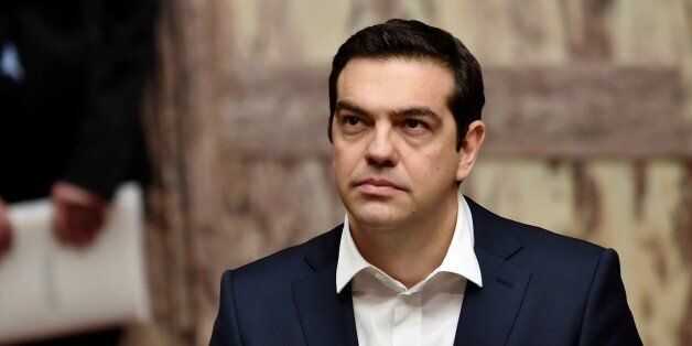 Greek Prime Minister Alexis Tsipras looks on during the swearing in ceremony of the New Greek President Prokopis Pavlopoulos (Unseen) in the parliament in Athens on March 13, 2015. AFP PHOTO / POOL / ARIS MESSINIS (Photo credit should read ARIS MESSINIS/AFP/Getty Images)