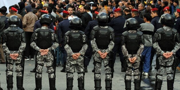 The Jordanian security surrounds the demonstration of the Muslim Brotherhood in downtown Amman, Jordan, Jordan, Friday, Nov.