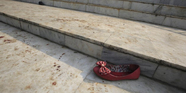 PESHAWAR, PAKISTAN - DECEMBER 17: Blood traces are seen at the ladder of school after Taliban attack on an army-run school on Tuesday, in Peshawar, Pakistan, on December 17, 2014. At least 141 people dead, most of them students as well as 6 gunmen killed. (Photo by Metin Aktas/Anadolu Agency/Getty Images)