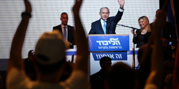 FILE - In this March 17, 2015 file photo, Israeli Prime Minister Benjamin Netanyahu greets supporters at the party's election headquarters in Tel Aviv, Israel. Netanyahu's Likud won 30 seats in the 120-seat parliament, and parties apparently willing to back him won another 37 for a possible majority. The reasons for that outcome go beyond the party's nationalist ideology and include Israel's sense of geographic vulnerability, its fragmented politics and a master campaigner in Netanyahu himself. (AP Photo/Oded Balilty, File)