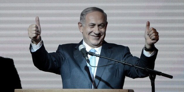 TEL AVIV, ISRAEL - MARCH 18: Israeli Prime Minister and the leader of the Likud Party Benjamin Netanyahu greets supporters at the party's election headquarters after the first results of the Israeli general election on March 18, 2015 in Tel Aviv, Israel. (Photo by Salih Zeki Fazlioglu/Anadolu Agency/Getty Images)