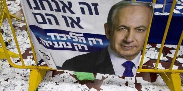 Copies of ballots papers and campaign posters for Israel's Prime Minister Benjamin Netanyahu's Likud Party lie on the ground in the aftermath of the country's parliamentary elections, early on March 18, 2015 in Tel Aviv. Netanyahu beat the odds to win a resounding election victory that will likely deepen tensions with the Palestinians and the West. AFP PHOTO / JACK GUEZ (Photo credit should read JACK GUEZ/AFP/Getty Images)