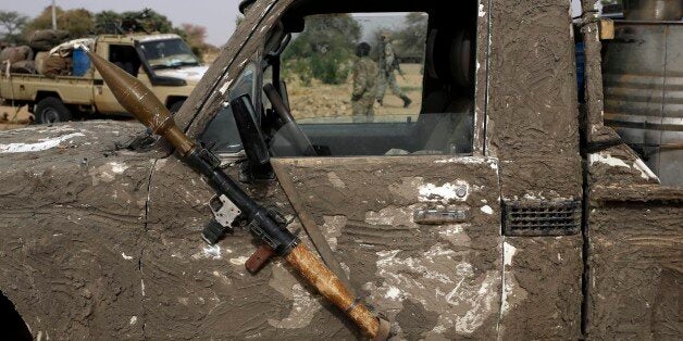 A rocket propelled launcher hangs on the mirror of a camouflaged Chadian pickup truck in the Nigerian city of Damasak, Nigeri