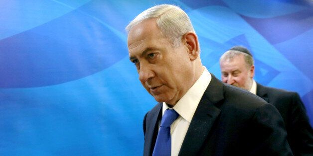 Israeli Prime Minister Benjamin Netanyahu arrives to chair the weekly cabinet meeting at his Jerusalem office, Sunday, March 8, 2015. Tens of thousands of Israelis gathered Saturday night at a Tel Aviv square under the banner "Israel wants change" and called for Netanyahu to be replaced in March 17 national elections. (AP Photo/Gali Tibbon, Pool)
