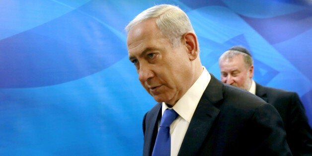 Israeli Prime Minister Benjamin Netanyahu arrives to chair the weekly cabinet meeting at his Jerusalem office, Sunday, March 8, 2015. Tens of thousands of Israelis gathered Saturday night at a Tel Aviv square under the banner "Israel wants change" and called for Netanyahu to be replaced in March 17 national elections. (AP Photo/Gali Tibbon, Pool)