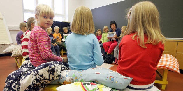 (FILES) This file picture dated 17 August 2005 shows children listening to their teacher in a primary school in Vaasa, on the second day of school in Finland. Finnish, South Korean and Taipei 15-year-olds scored highest in the world on tests of science, reading and maths knowledge, the Organization for Economic Cooperation and Development (OECD) announced 04 December 2007. Finland topped the science results, with a score of 563, followed by Hong Kong, with 542, and Canada, at 534. AFP PHOTO OLIVIER MORIN (Photo credit should read OLIVIER MORIN/AFP/Getty Images)