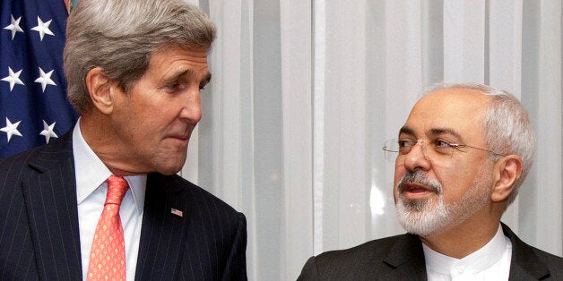 U.S. Secretary of State John Kerry, left, listens to Iran's Foreign Minister Mohammad Javad Zarif, right, before resuming tal