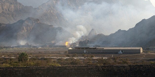 ADEN, YEMEN - MARCH 28: Smoke rises over following the explosion in the armory of Yemeni military in Jebel Hadid region of Aden, Yemen on March 28, 2015. (Photo by Wail Shaif Thabet/Anadolu Agency/Getty Images)