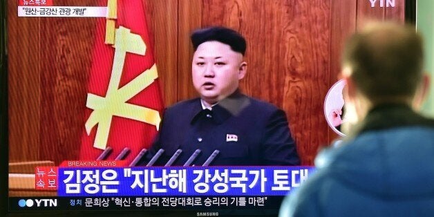A South Korean man watches a television screen showing North Korean leader Kim Jong-Un's New Year speech, at a railroad stati