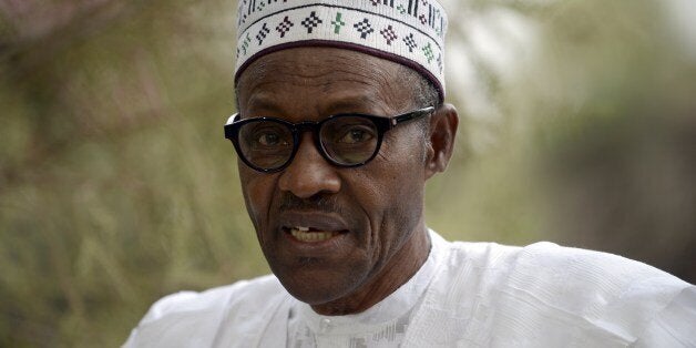 Main opposition All Progressives Congress (APC) presidential candidate Mohammadu Buhari speaks after casting his vote at a polling station in the 'Gidan Niyam Sakin Yara A ward' at Daura in Katsina State on March 28, 2015. Voting began in Nigeria's general election but delays were reported countrywide because of technical problems in accrediting electors. AFP PHOTO/PIUS UTOMI EKPEI (Photo credit should read PIUS UTOMI EKPEI/AFP/Getty Images)