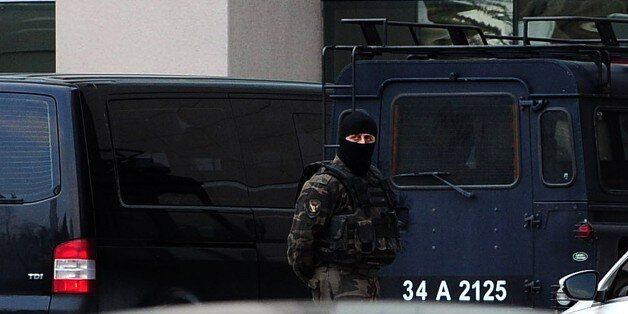 Turkish special forces take position on March 31, 2015 in Istanbul in front of the courthouse where a Turkish prosecutor, probing the politically sensitive death of an anti-government protester, was taken hostage by an armed group, the Dogan news agency reported. Mehmet Selim Kiraz was investigating the killing of Berkin Elvan, who died in March 2014 after spending 269 days in a coma due to injuries inflicted by police in the mass protests of early summer 2013. AFP PHOTO / OZAN KOSE (Photo credit should read OZAN KOSE/AFP/Getty Images)