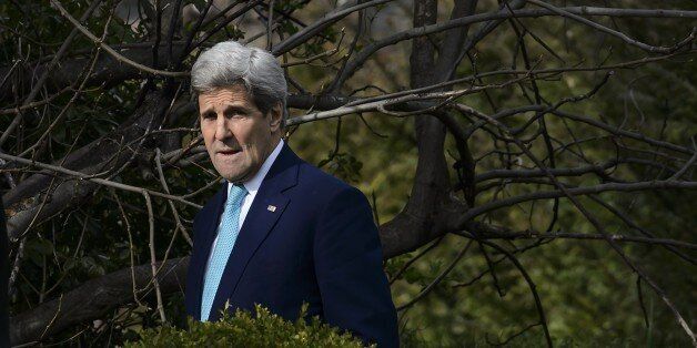 US Secretary of State John Kerry looks on during a walk in the garden of the Beau-Rivage Palace hotel during a break in Iran nuclear talks in Lausanne on April 1, 2015. Rollercoaster talks aimed at stopping Iran getting a nuclear bomb went into extra time amid cautious signs that after seven days of tough negotiations a framework deal may be near. AFP PHOTO / FABRICE COFFRINI (Photo credit should read FABRICE COFFRINI/AFP/Getty Images)