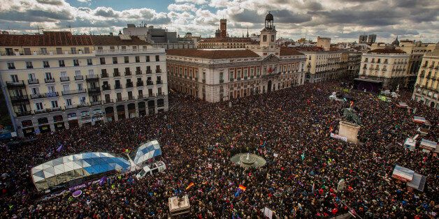 People gather in the main square of Madrid during a Podemos (We Can) party march in Madrid, Spain, Saturday, Jan. 31, 2015. Tens of thousands of people, possibly more, are marching through Madridâs streets in a powerful show of strength by Spainâs fledgling radical leftist party Podemos (We Can) which hopes to emulate the electoral success of Greeceâs Syriza party in elections later this year. Supporters from across Spain converged onto Cibeles fountain before packing the avenue leading to Puerta del Sol square. Podemos aims to shatter the countryâs predominantly two-party system and the âMarch for Changeâ gathered crowds in the same place where sit-in protests against political and financial corruption laid the partyâs foundations in 2011. (AP Photo/Andres Kudacki)