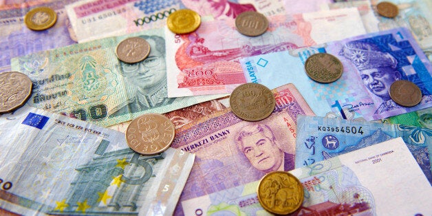 Various currencies from around the world, some now defunct. Pictured currencies: Finnish Markka, Australian Dollar, Thai Baht