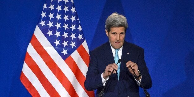 US Secretary of State John Kerry arrives at the podium during a press conference at the Swiss Federal Institute of Technology in Lausanne (Ecole Polytechnique Federale De Lausanne) on April 2, 2015, after the announcement of an agreement on Iran nuclear talks. European powers and Iran on April 2 hailed a breakthrough in talks on reaching a deal to curtail Tehran's nuclear programme. AFP PHOTO / FABRICE COFFRINI (Photo credit should read FABRICE COFFRINI/AFP/Getty Images)