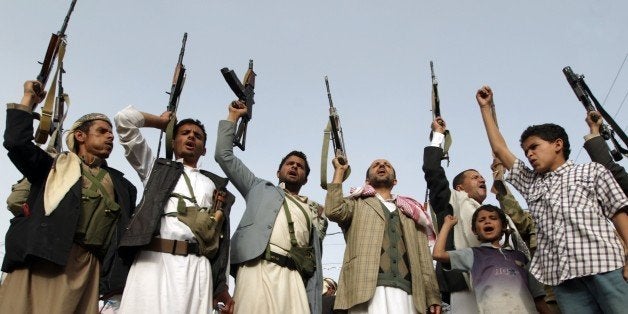 Supporters of the Shiite Huthi militia brandish their weapons in the Yemeni capital Sanaa on April 5, 2015, during a demonstration against Saudi-led coalitions Operation Decisive Storm against the Huthi rebels. Russia presented a draft resolution to the UN Security Council calling for a humanitarian pause in the Saudi-led air war against the Huthis, now in its 11th day. AFP PHOTO / MOHAMMED HUWAIS (Photo credit should read MOHAMMED HUWAIS/AFP/Getty Images)