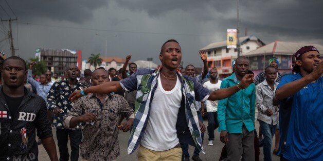 All Progressives Congress (APC) party supporters march towards the Independent National Electoral Commission Office in Port Harcourt during a demonstration calling for the cancellation of the Presidential elections in the Rivers State on March 29, 2015. Thousands of supporters of Nigeria's main opposition party demonstrated in the southern state of Rivers, calling for the cancellation of elections locally because of alleged irregularities.AFP PHOTO/FLORIAN PLAUCHEUR (Photo credit should read FLORIAN PLAUCHEUR/AFP/Getty Images)