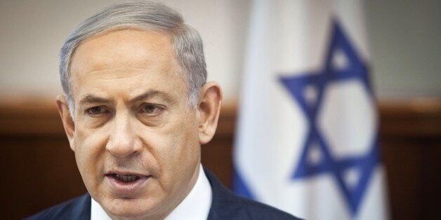 Israeli Prime Minister Benjamin Netanyahu chairs the weekly cabinet meeting at his Jerusalem office on March 29, 2015. Netany