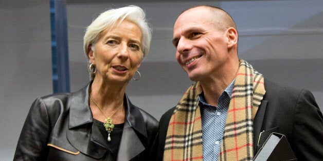 Managing Director of the International Monetary Fund Christine Lagarde, left, shakes hands with Greek Finance Minister Yanis Varoufakis during a meeting of eurogroup finance ministers in Brussels on Wednesday, Feb. 11, 2015. Leading European officials downplayed expectations that a comprehensive debt deal with Greece is likely Wednesday at an emergency meeting in which Greeceâs finance minister is set to unveil a plan to loosen austerityâs grip on his economy. (AP Photo/Virginia Mayo)