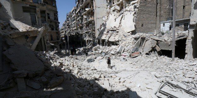 A man walks through the rubble following reported air strikes by government forces on the eastern Shaar neighbourhood of the northern Syrian city of Aleppo on March 27, 2015. AFP PHOTO / AMC / ZEIN AL-RIFAI (Photo credit should read ZEIN AL-RIFAI/AFP/Getty Images)