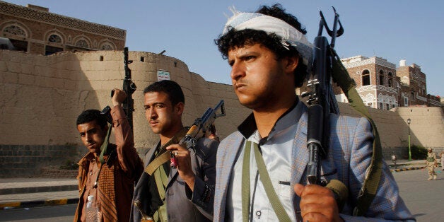 FILE - In this Wednesday, April 1, 2015 file photo, Shiite rebels, known as Houthis, carry their weapons as they march to protest against Saudi-led airstrikes, during a rally in Sanaa, Yemen. Saudi-led coalition warplanes bombed Shiite rebel positions in both north and south Yemen early Wednesday, setting off explosions and drawing return fire from anti-aircraft guns. (AP Photo/Hani Mohammed, File)