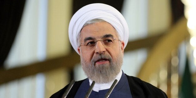 Iranian President Hassan Rouhani speaks during a press conference in Tehran on April 3, 2015. Iran vowed to stand by a nuclear deal with world powers as Rouhani promised it would open a 'new page' in the country's global ties. AFP PHOTO/ATTA KENARE (Photo credit should read ATTA KENARE/AFP/Getty Images)