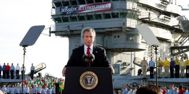 FILE - In this May 1, 2003 file photo, President George W. Bush speaks aboard the aircraft carrier USS Abraham Lincoln off th