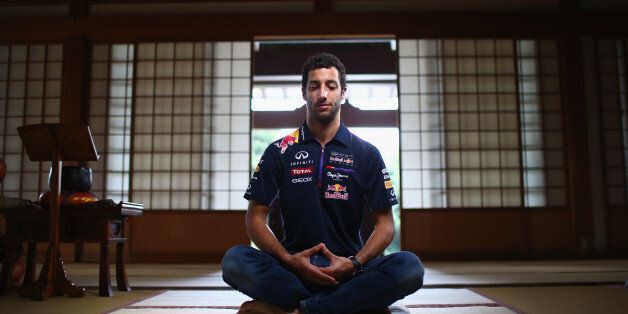SUZUKA, JAPAN - OCTOBER 01: Daniel Ricciardo taking part in Zazen, Zen meditation at the Zenshoan Temple in Tokyo ahead of the Japanese Formula One Grand Prix at Suzuka Circuit on October 1, 2014 in Suzuka, Japan. (Photo by Mark Thompson/Getty Images)