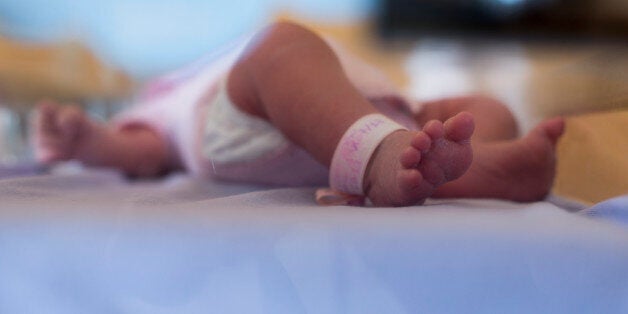 A picture shows the feet of a new-born at the maternity of the Argenteuil hospital, in a Paris suburb, on July 22, 2013. AFP PHOTO / FRED DUFOUR (Photo credit should read FRED DUFOUR/AFP/Getty Images)