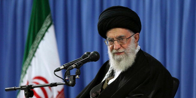 In this picture released by an official website of the office of the Iranian supreme leader, Supreme Leader Ayatollah Ali Khamenei attends a meeting with a group of religious performers in Tehran, Iran, Thursday, April 9, 2015. Iran's top leader on Thursday stopped short of giving his endorsement to the framework nuclear deal struck last week between Teheran and world powers, while the country's president warned separately that Tehran's approval of a final deal depends on the immediate lifting of all sanctions related to its controversial nuclear program. (AP Photo/Office of the Iranian Supreme Leader)