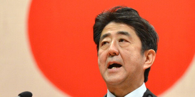 Japanese Prime Minister Shinzo Abe delivers a speech during a graduation ceremony at the National Defense Academy in Yokosuka, Kanagawa Prefecture on March 17, 2013. Abe urged new graduates of the academy to guard against 'provocations' amid simmering tensions with China over the sovereigniy of an island chain. AFP PHOTO / KAZUHIRO NOGI (Photo credit should read KAZUHIRO NOGI/AFP/Getty Images)