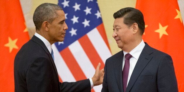 U.S. President Barack Obama, left, and Chinese President Xi Jinping shake hands following the conclusion of their joint news