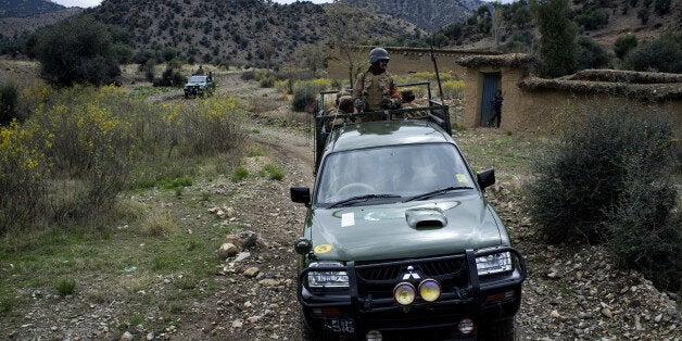 In this Thursday, March 28, 2013 photo, Pakistan army soldiers patrol Sararogha, which was the stronghold of the Taliban in S