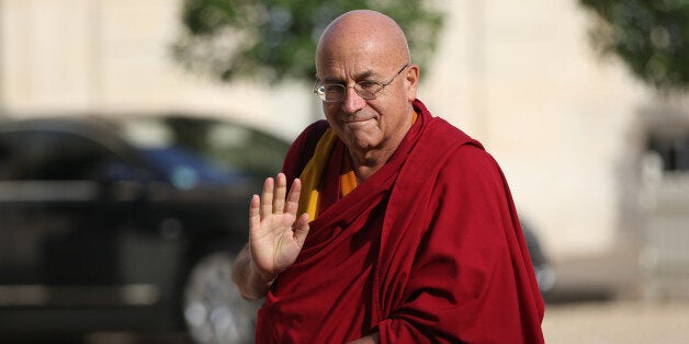 French Buddhist monk Matthieu Ricard arrives on September 21, 2013 at the Elysee presidential Palace in Paris. AFP PHOTO / KE