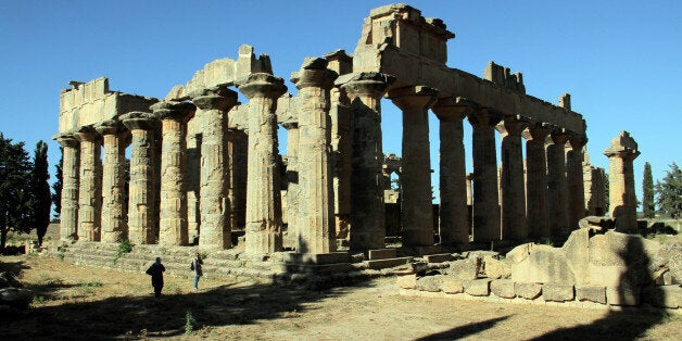 A general view shows people visiting the ruins of Cyrene, on May 26, 2013, a colony of the Greeks of Thera (Santorini) and a principal city in the Hellenic world founded in 630 BC, located in Libya's Green Mountains or Jebel Akhdar, close to present-day Shahat, east of Benghazi. AFP PHOTO/ABDULLAH DOMA (Photo credit should read ABDULLAH DOMA/AFP/Getty Images)