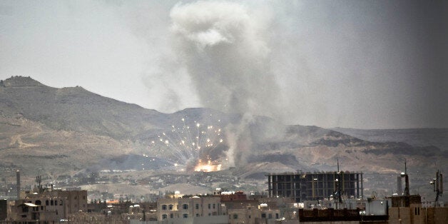 FILE - In this Tuesday, April 21, 2015 file photo, smoke rises after a Saudi-led airstrike hits a site where many believe the largest weapons cache in Yemen's capital, Sanaa. (AP Photo/Hani Mohammed, File)