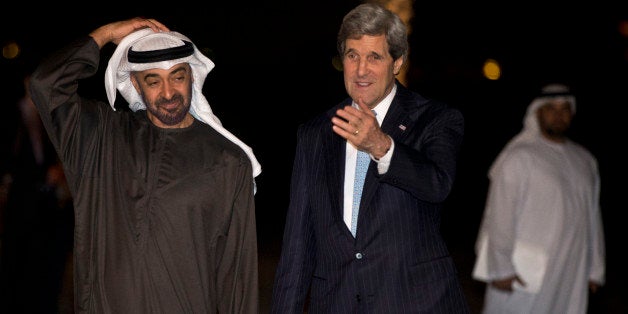 Abu Dhabi Crown Prince Sheik Mohammed bin Zayed al Nahyan, left, walks with U.S. Secretary of State John Kerry to pose with him for a photograph before their dinner meeting at the Emirates Palace hotel in Abu Dhabi, United Arab Emirates on Monday, March 4, 2013. Abu Dhabi is the eighth stop of Kerry's first official overseas trip. (AP Photo/Jacquelyn Martin, Pool)