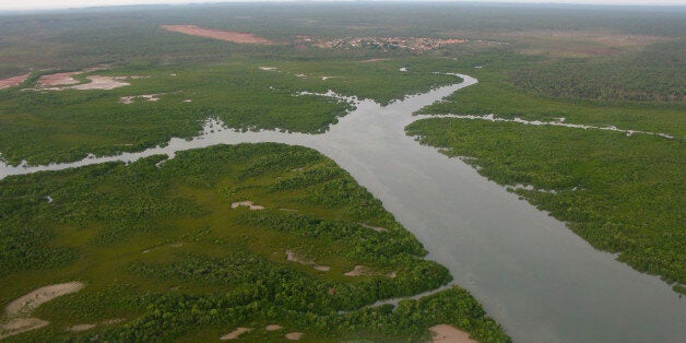 In this May 29, 2009, photo, the remote town of Wadeye in the Northern Territory in Australia, is seen on approach in a light aircraft. Wadeye, with a population of 2,500, the largest Aboriginal community in Australia's remote Northern Territory, is a reminder of the tortured relationship with its oldest inhabitants, and the government's endless failed attempts to right the wrongs it's wrought. (AP Photo/Kristen Gelineau)