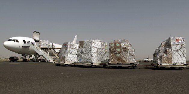 Emergency medical aid from the International Committee of the Red Cross is unloaded from a plane at the international airport in Sanaa on April 11, 2015. AFP PHOTO / MOHAMMED HUWAIS (Photo credit should read MOHAMMED HUWAIS/AFP/Getty Images)