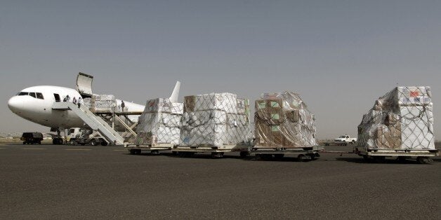Emergency medical aid from the International Committee of the Red Cross is unloaded from a plane at the international airport