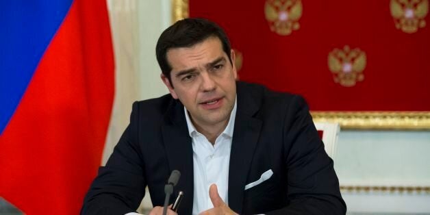 Greek Prime Minister Alexis Tsipras speaks at a joint news conference with Russian President Vladimir Putin after a signing c
